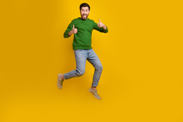 Full body photo of jumping man business startup start double thumbs up thankful for government support isolated on yellow color background
