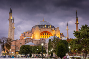 Dramatic cloudy sky at twilight over Hagia Sophia mosque and Sultanahmet Square, Istanbul, Turkey