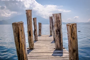 Fotobehang wooden pier on the lake © Abraham