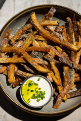 Close up of fries with aioli 