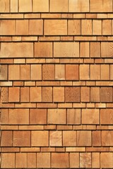 Wooden cedar shake siding vertical exterior architecture background pattern
