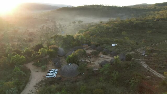 aerial view village in Chapada dos Veadeiros "Aldeia Macaco" hollow-shaped bioconstruction houses cerrado landscape Goi&aacute;s Brazil