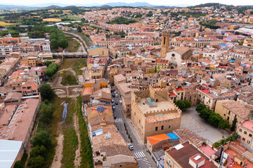 Scenic aerial view of small Catalan township of La Bisbal d Emporda overlooking Santa Maria church...