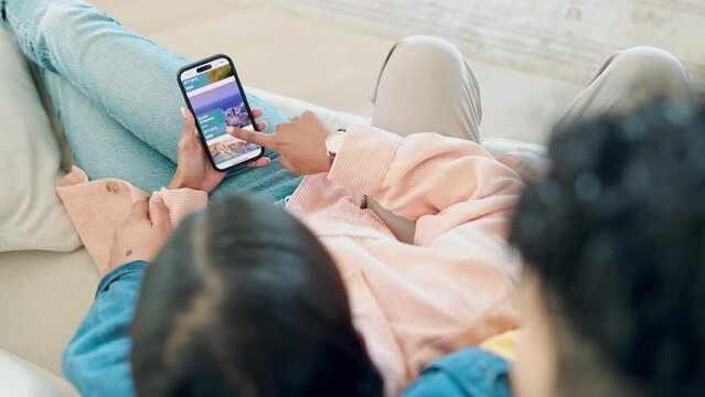 Couple hands, sofa and phone for holiday planning, vacation information and news, blog or contact us on screen. People scroll on mobile app for travel agency FAQ, reading website and choice at home