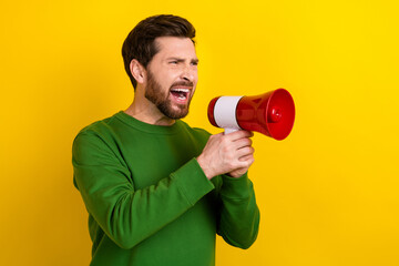 Photo of young funny businessman wear green sweater screaming megaphone aggression speech conflict...