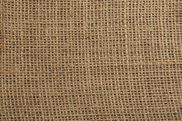 Texture of burlap fabric as background, top view