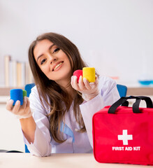 Female beautiful doctor with first aid bag