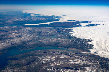 Aerial of Greenland ice cap and coastal areas.