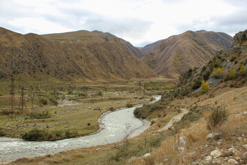 Mountain river surrounded by the mountains in Caucasus region of Russia