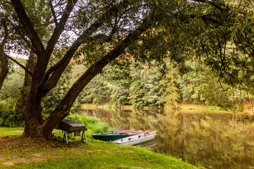 Fototapeta premium Evening view of boats at Luznice river, Czech Republic