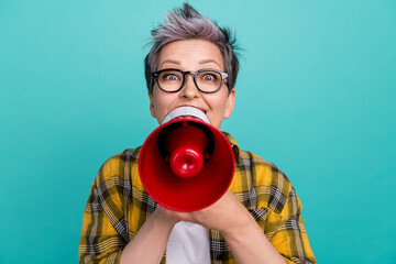 Photo of charming grandmother hold shout loudspeaker dressed stylish checkered yellow outfit...