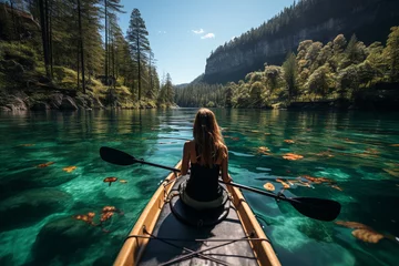 Foto op Canvas beautiful woman in canoe kayaking in Canadian lake. © Наталья Добровольска