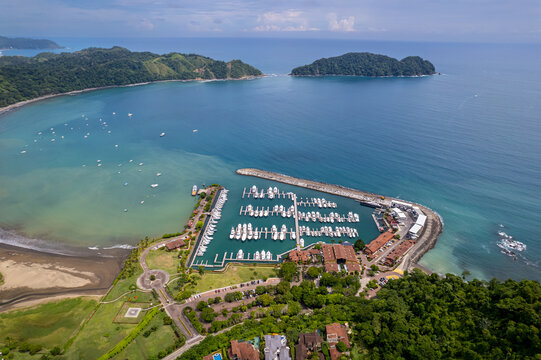 Beautiful aerial view of the Los Sue&ntilde;os Marina full with yachts and boats in Herradura Beach - Costa Rica