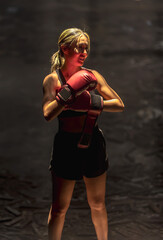 Boxer woman guarding up training Thai boxing