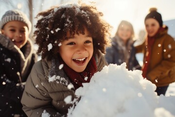 Happy and diverse young group of kids and children playing in the snow during winter