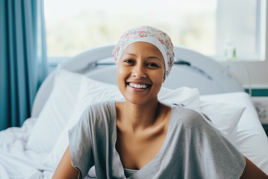 Smiling portrait of a female caucasian woman beating cancer in a hospital