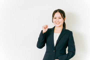 やる気に満ちたビジネスウーマン（ガッツポーズ・成功・笑顔・やる気）
