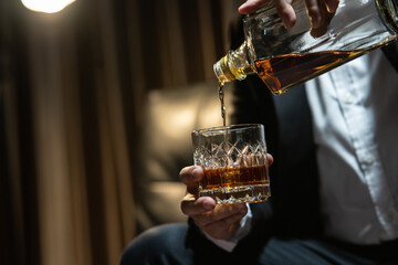 Businessmen in suits drinking  Celebrate whiskey.