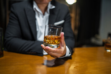 Businessmen in suits drinking  Celebrate whiskey.