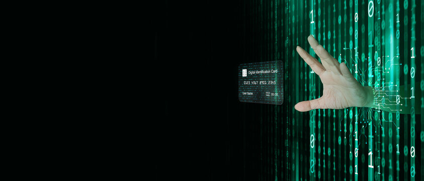 A hacker behind binary code, stream of data, able to break through cyber security and reaches his hand out to control your personal identity