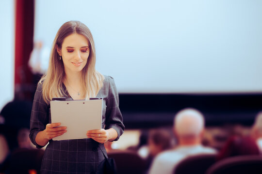 Happy Woman Holding a Clipboard Attending a Conference. Smiling businesswoman going to a corporate international summit
