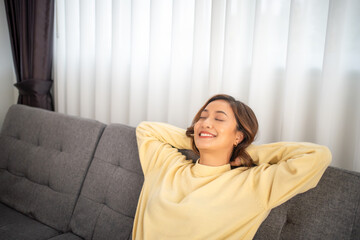 Asian Woman relaxing and sleep on sofa at home