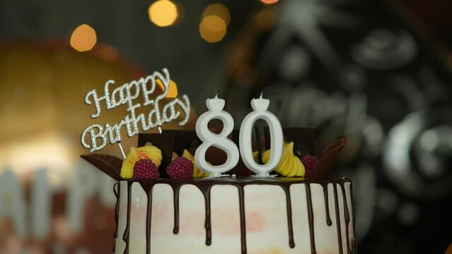 80th Birthday Cake and a happy birthday sign