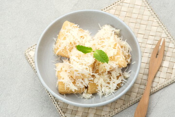 Fried cassava with cheese or singkong goreng keju, Indonesian traditional food. 
