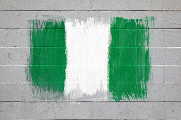 Nigerian flag colors painted on brick wall