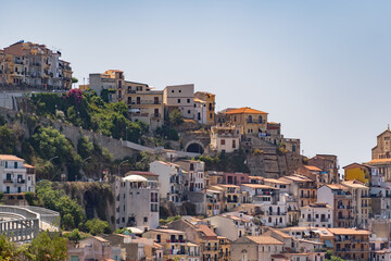 Fototapeta na wymiar Beautiful colorful cityscape on the mountains over Mediterranean sea, small italian town, traditional Italian architecture
