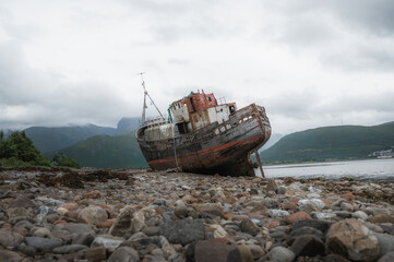 Old boat of Caol shipwreck in Corpach near Fort William on a rainy day.Tourism,scottish landmarks