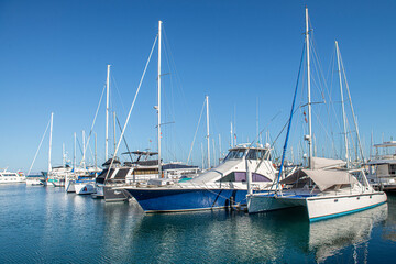 Fototapeta premium Yachts or boats on a sunny morning in a marina in La Paz Baja California Sur. Mexico. With clear blue summer sky