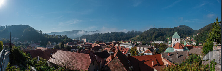 Wide panorama of Lasko city in central slovenia with visible main attractions in early morning sun. Lasko well known for its thermal baths and beer brewing.