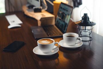 Coffee on the desk in the morning
