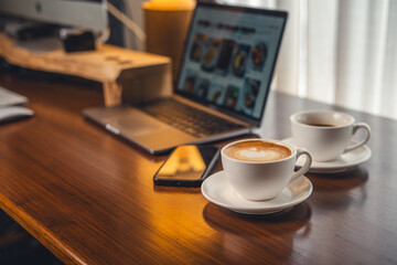 Coffee on the desk in the morning