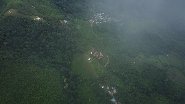 Birdseye view of settlement in the Sop Moei district, Vietnam. Fog descending over ground below