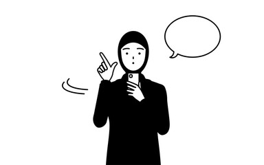 スマホを操作するイスラムの女性