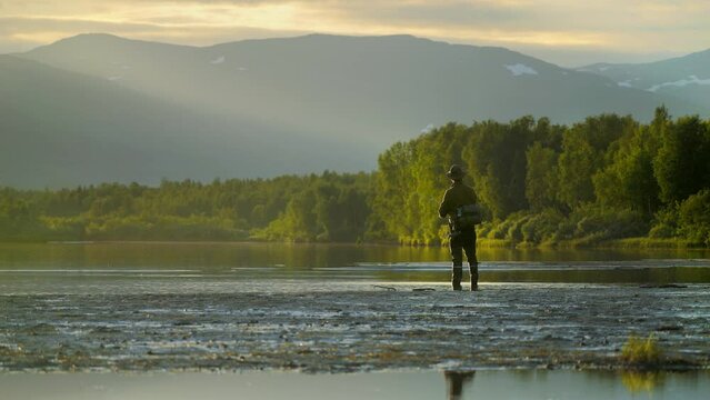 Casting Fisherman fishing in calm waters, Columbia River, Oregon