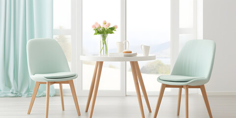 Two mint color chairs at round wooden dining table against window dressed with light green and white curtains. Scandinavian interior design of modern dining room