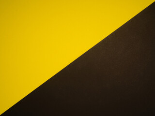 Yellow and black backdrop paper background. Top view