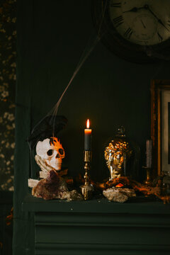 Halloween party decor in gloomy dark colors with retro elements and skulls