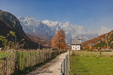 Village walking way with beautiful view of alps. Theth, Albania.