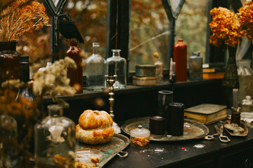 Halloween party decor in gloomy dark colors with the table is set