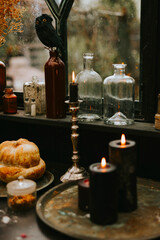 Halloween party decor in gloomy dark colors with the table is set