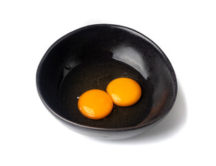 Two Broken Eggs in Bowl Isolated, Raw Yolk and White, Fresh Broken Organic Chicken Eggs