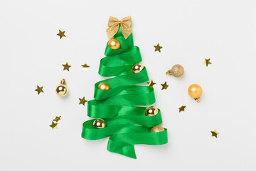 Creative handmade christmas tree with decor on color background, top, view