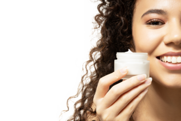 PNG,attractive girl with face cream in handst, isolated on white background