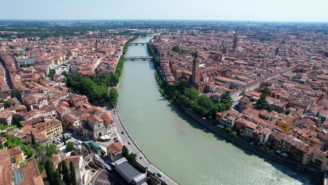 4K Aerial shot of ancient city center of Verona with the Adigio river, Italy