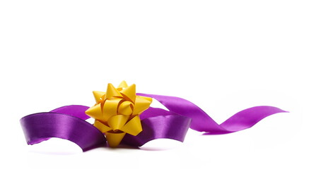 Purple ribbon with bow isolated on white, side view 
