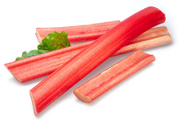Rhubarb stems' cuts isolated on white background.